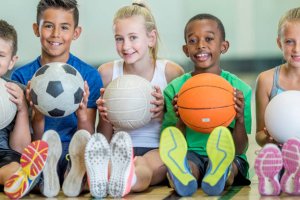 Picture of children with football, basketball & volleyball